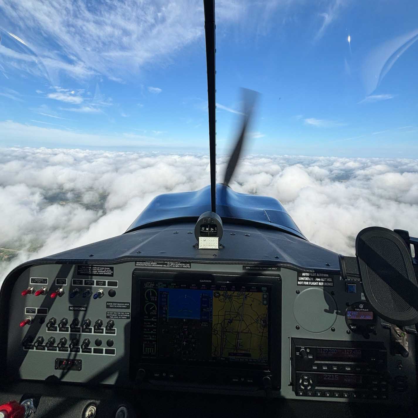 View over the cowling above the clouds